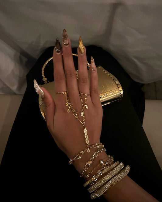 Gold hand chain and gold rings