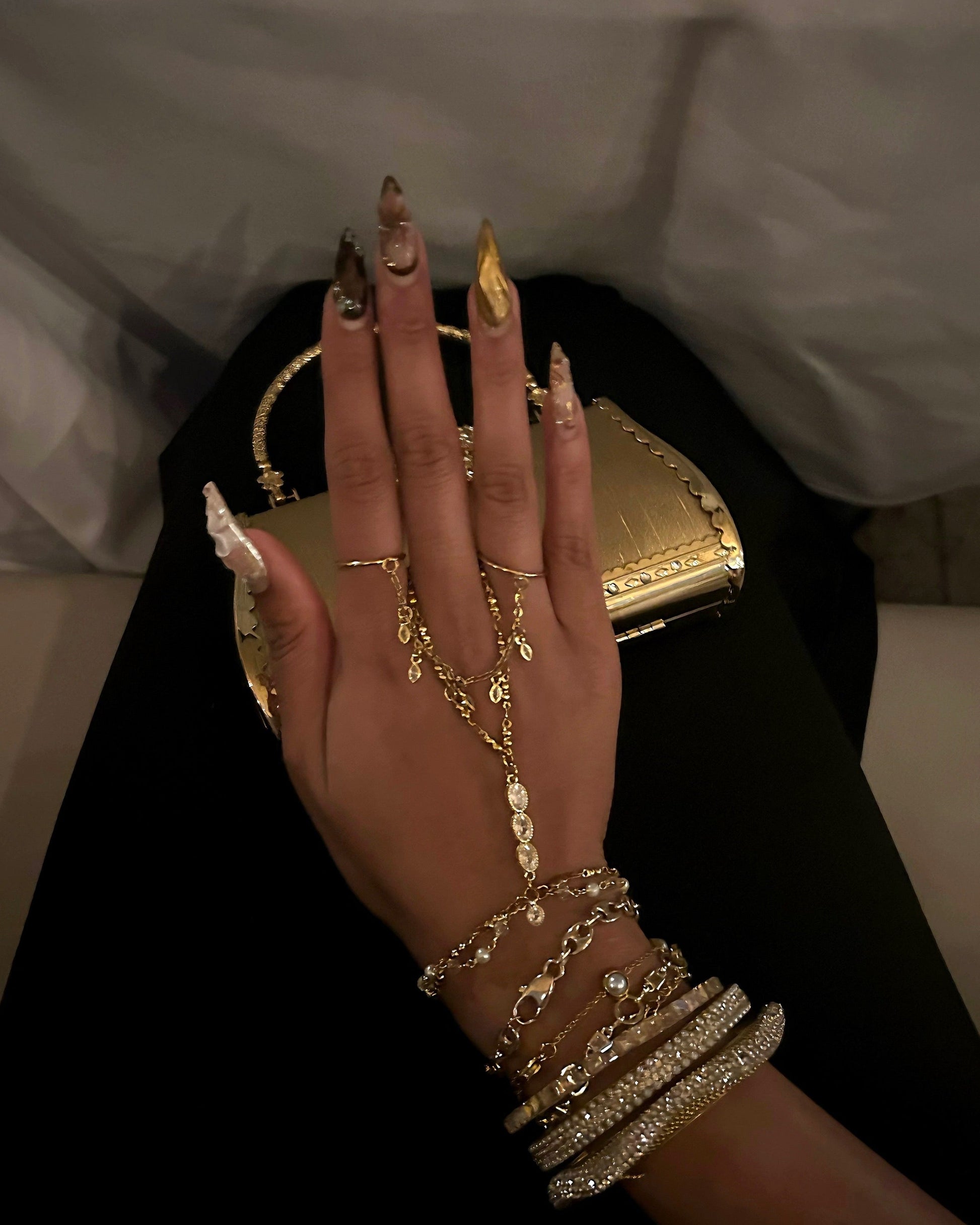 Gold hand chain and gold rings